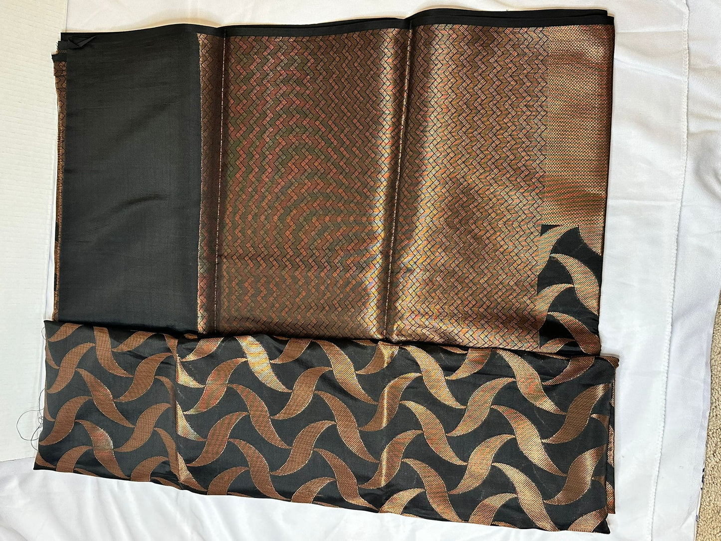 Black with copper zari saree
