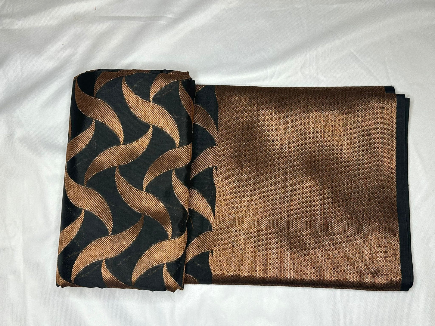 Black with copper zari saree