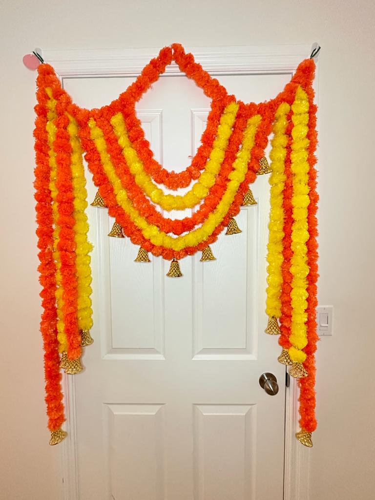 Yellow and orange artificial marigold backdrop with bells